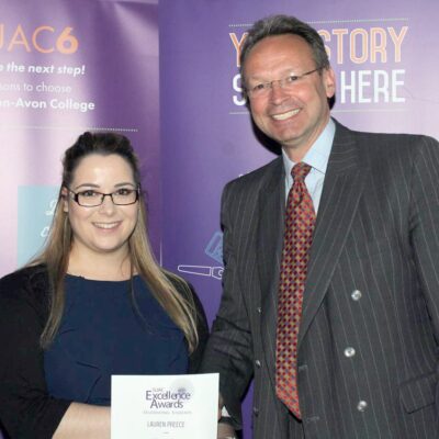 Business Support Apprentice Lauren Preece congratulated by College Principal and CEO Andrew Cropley.