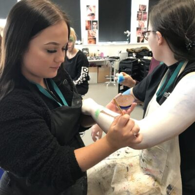 student doing body painting