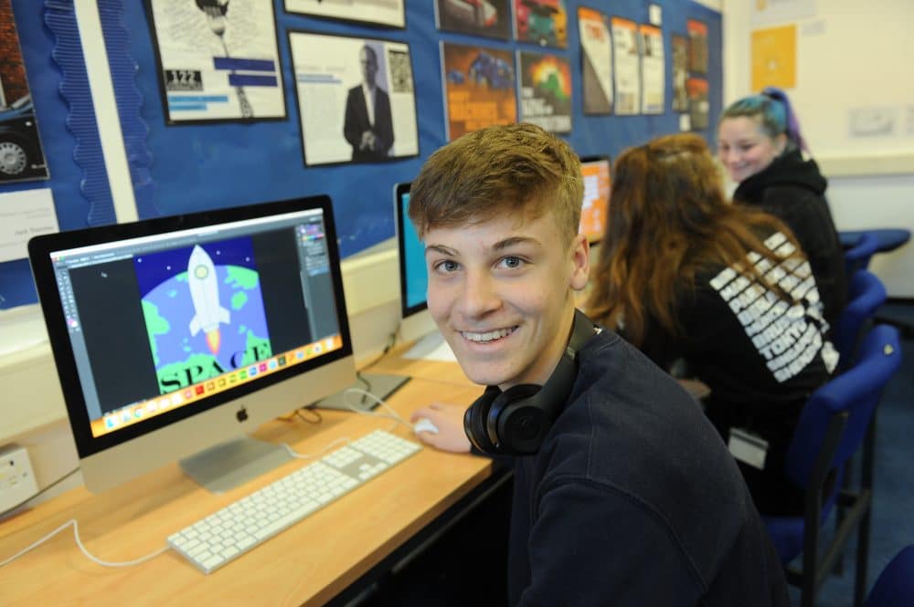 zoomed out version of a student in graphic design