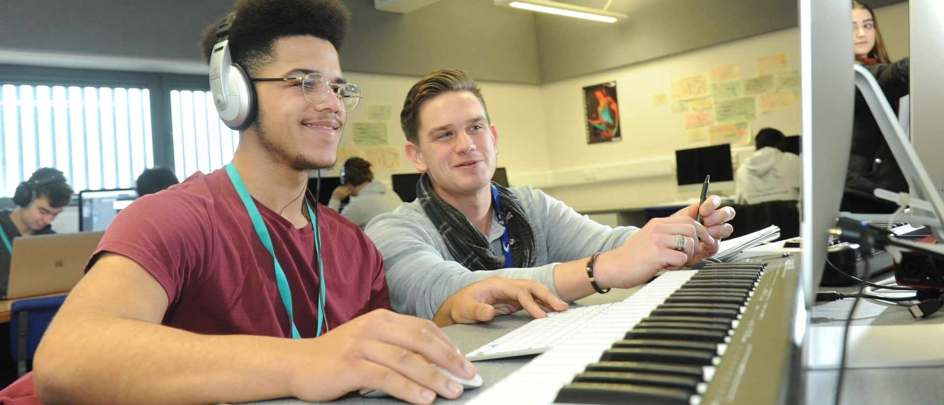 Staff member offers guidance to student.