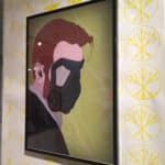 Framed illustration of a man wearing a gas masked.