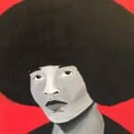 Black and white painted person against a red background.