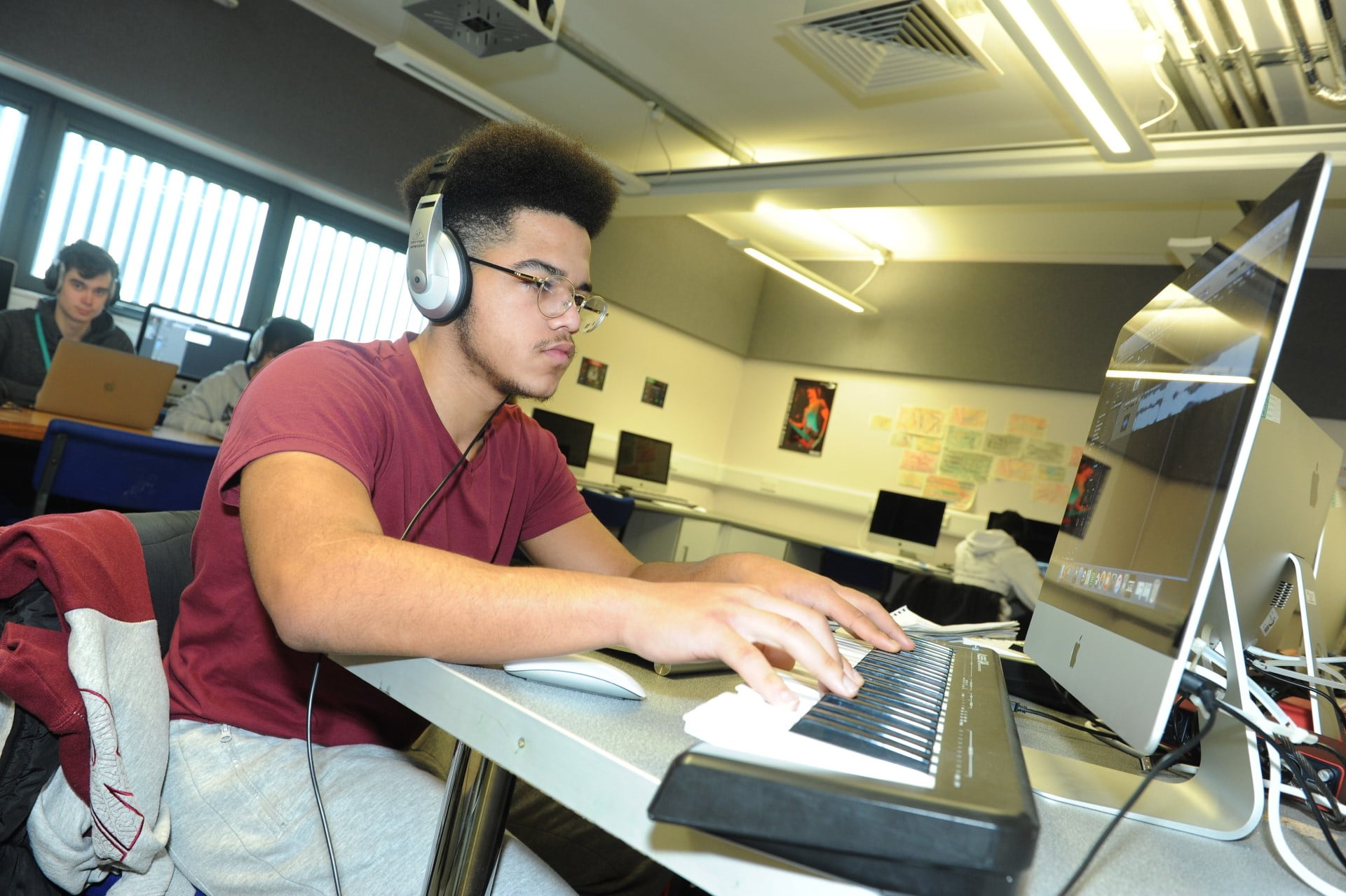 Music production student working at a computer.