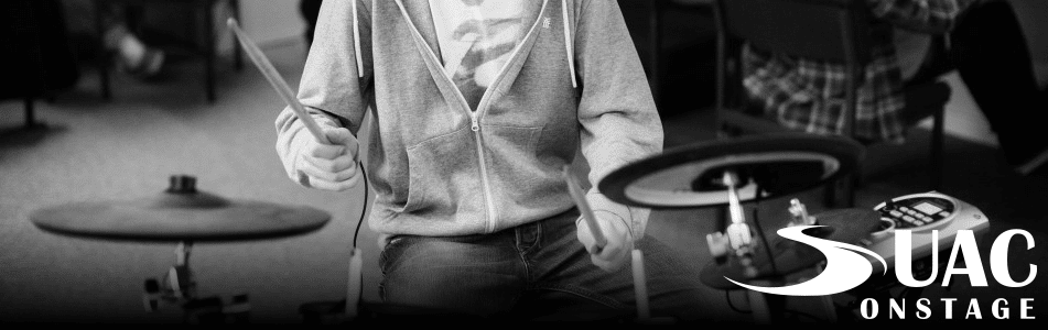 suac onstage performing drummer