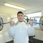 Sports student using gym equipment.