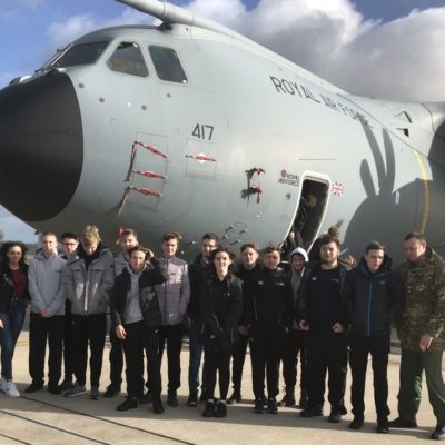 UPS students with RAF plane