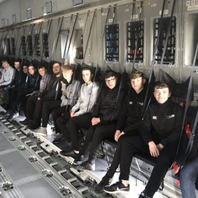 UPS students sitting on a plane