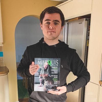 graphic Design student holding magazine