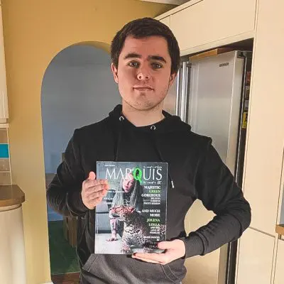 graphic Design student holding magazine