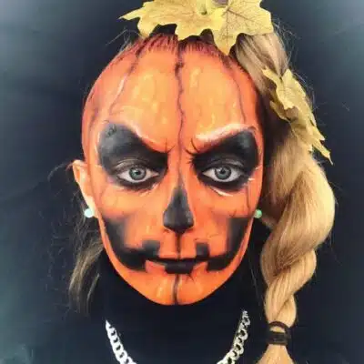 Student with scary pumpkin make-up