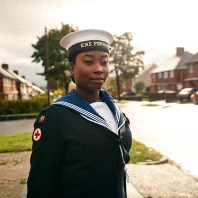 Nicole in Navy Uniform with hands behind back