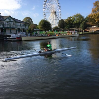 Student in distance on boat