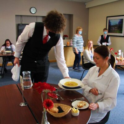 student serving tutor
