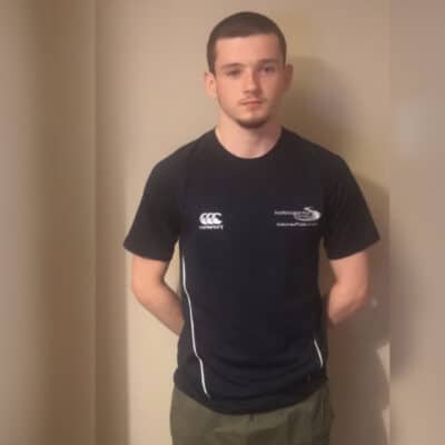 Jack standing in college shirt