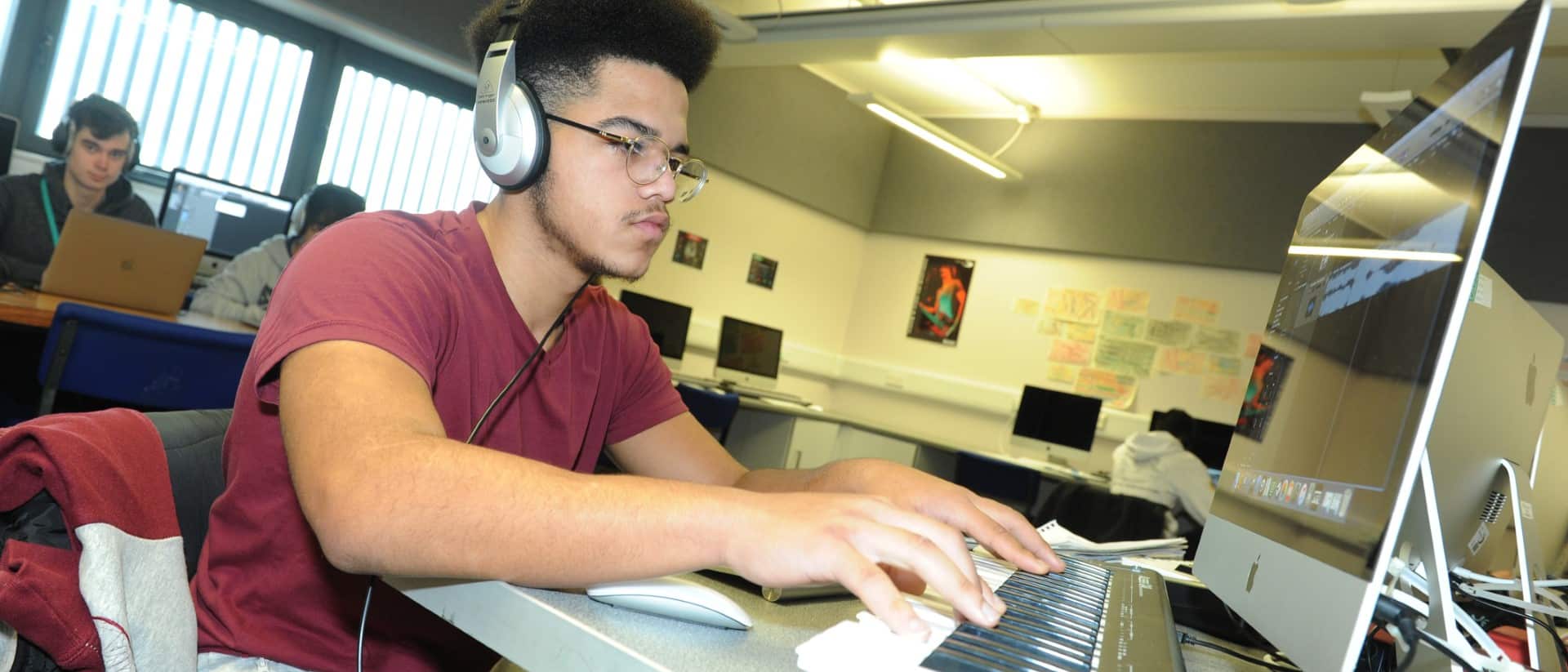 Music production student working at a computer.