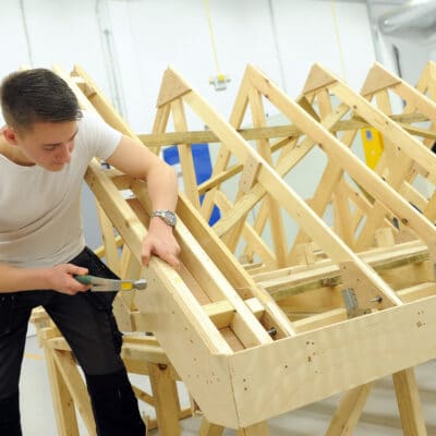 Student hammering wood at Stratford-Upon-Avon College
