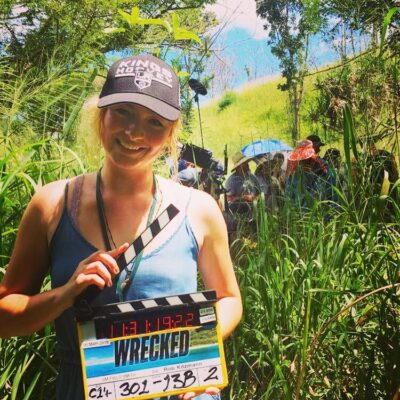 student holding wrecked clapper board