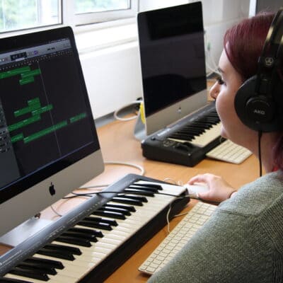 student on Mac and keyboard