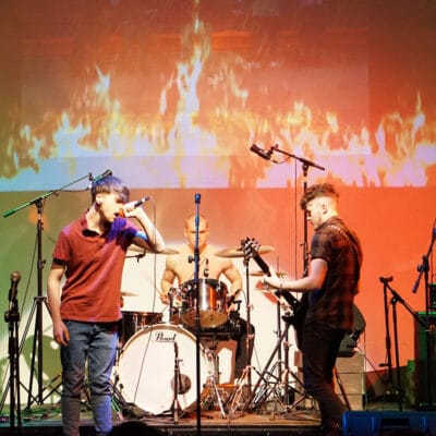 students performing on stage