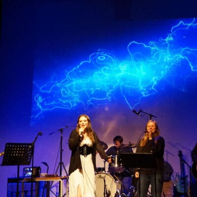students on stage performing