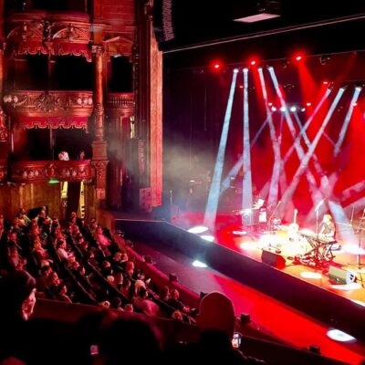 Isaac on stage at the London Palladium college trip