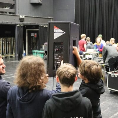 John with students and a speaker at stratford-upon-avon college