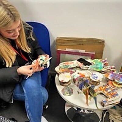 student painting elephant