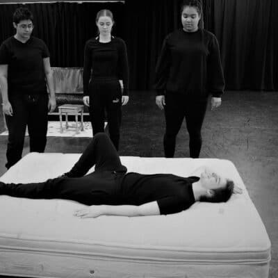 Student lying on matress