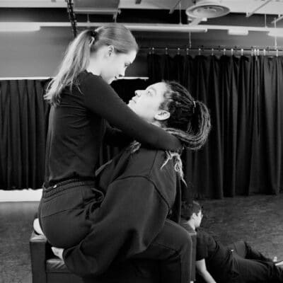 Two students in carry position