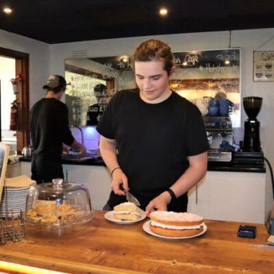 Harry Steward cutting cake