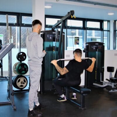 Sport students on pulling machine