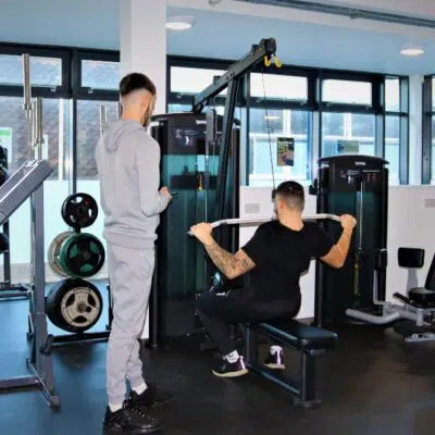 Sport students on pulling machine