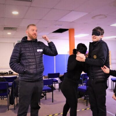Andy and Tom with students on exercises