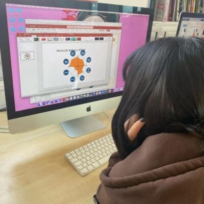 Student on computer doing wheel exercise