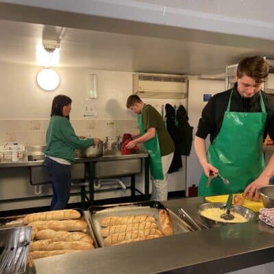Studnets cooking in kitchen