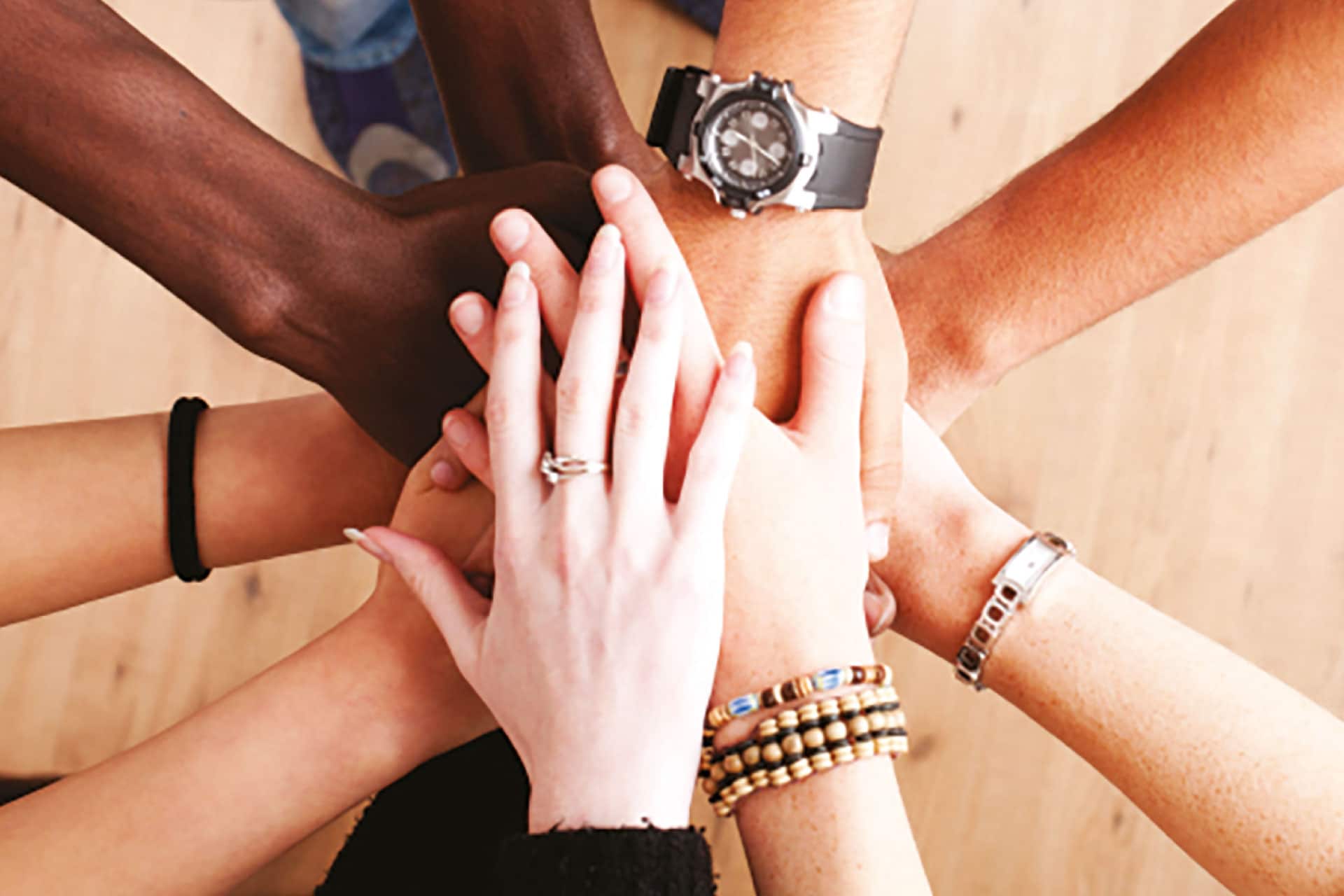 Humans hands together.