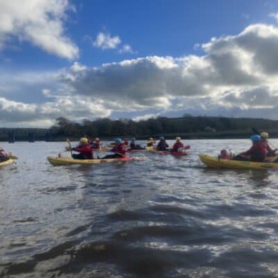 Public Service Students taking on rafting in yellow boats