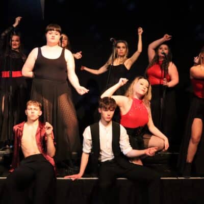 Students posing in Moulin Rouge