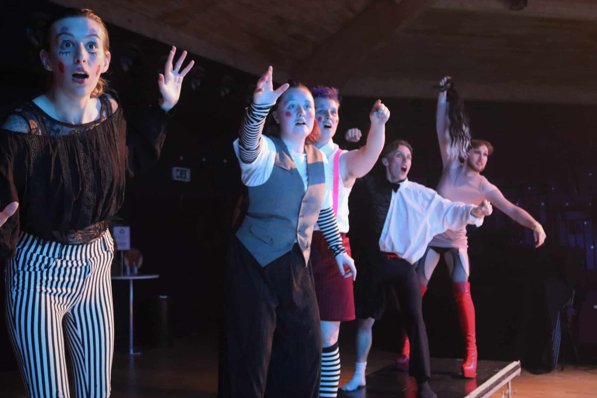 Students in cabaret freeze frame