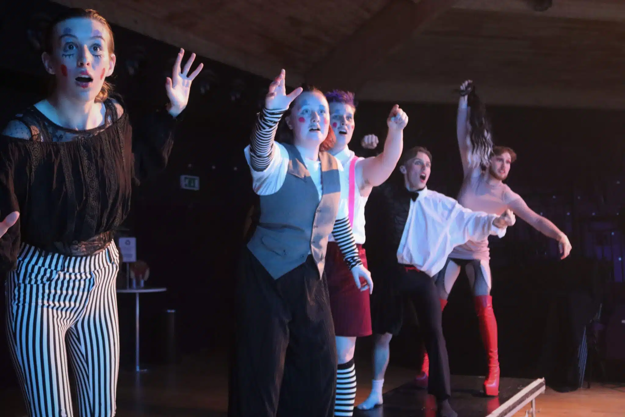 Students in cabaret freeze frame
