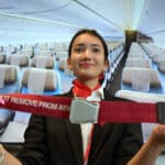 student with seat belt in cabin crew