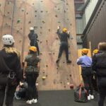 students on a climbing wall