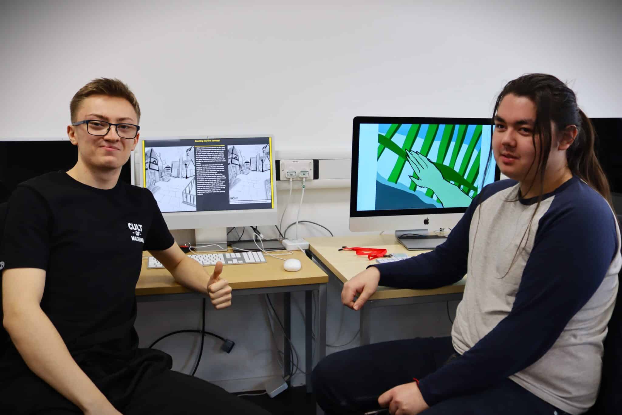 graphic design students with their work