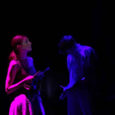 couple on stage in lights
