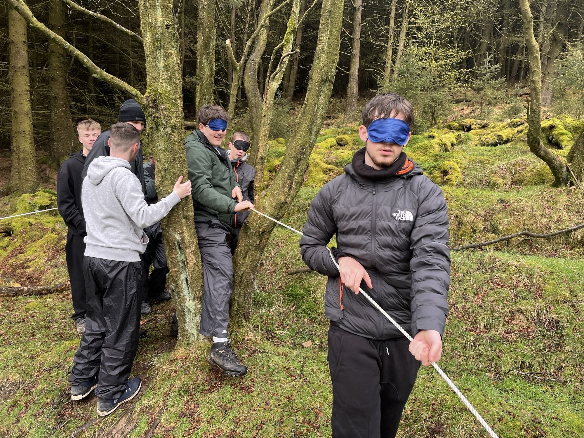 UPS students take part in Peak District challenge - students walking with the help of cord