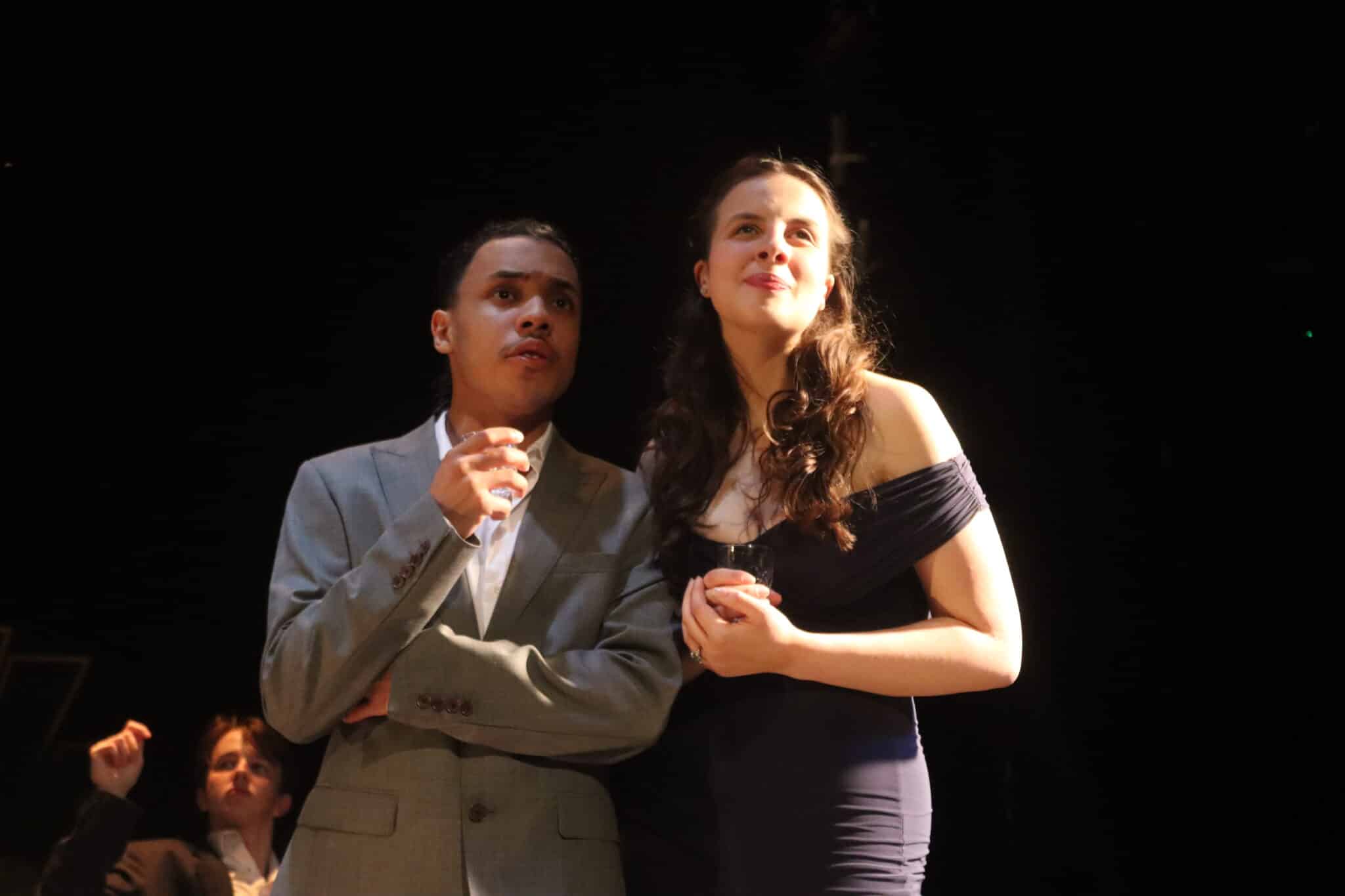 Two people staring off camera lovingly