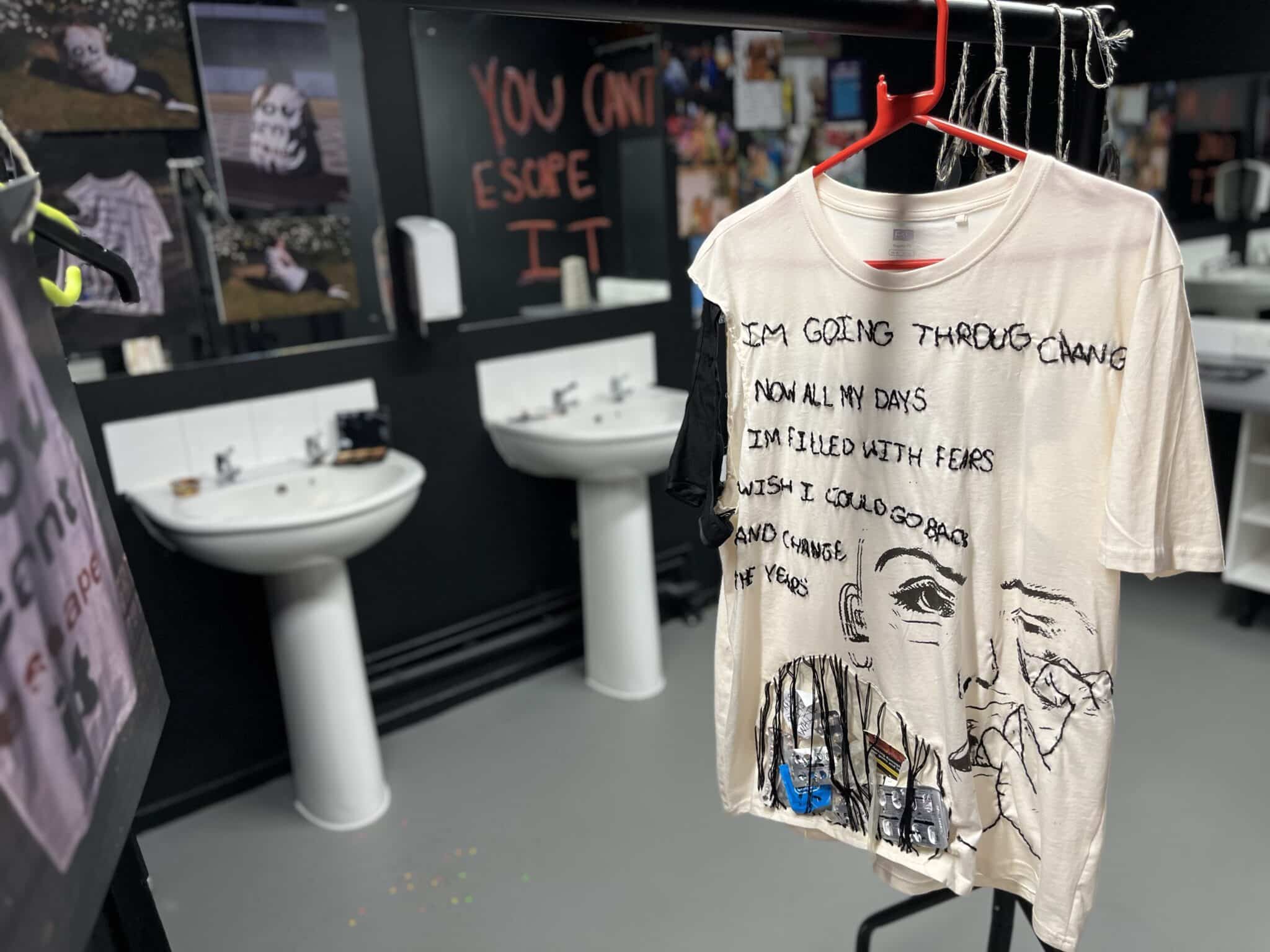 Shirt with writing on hanging up