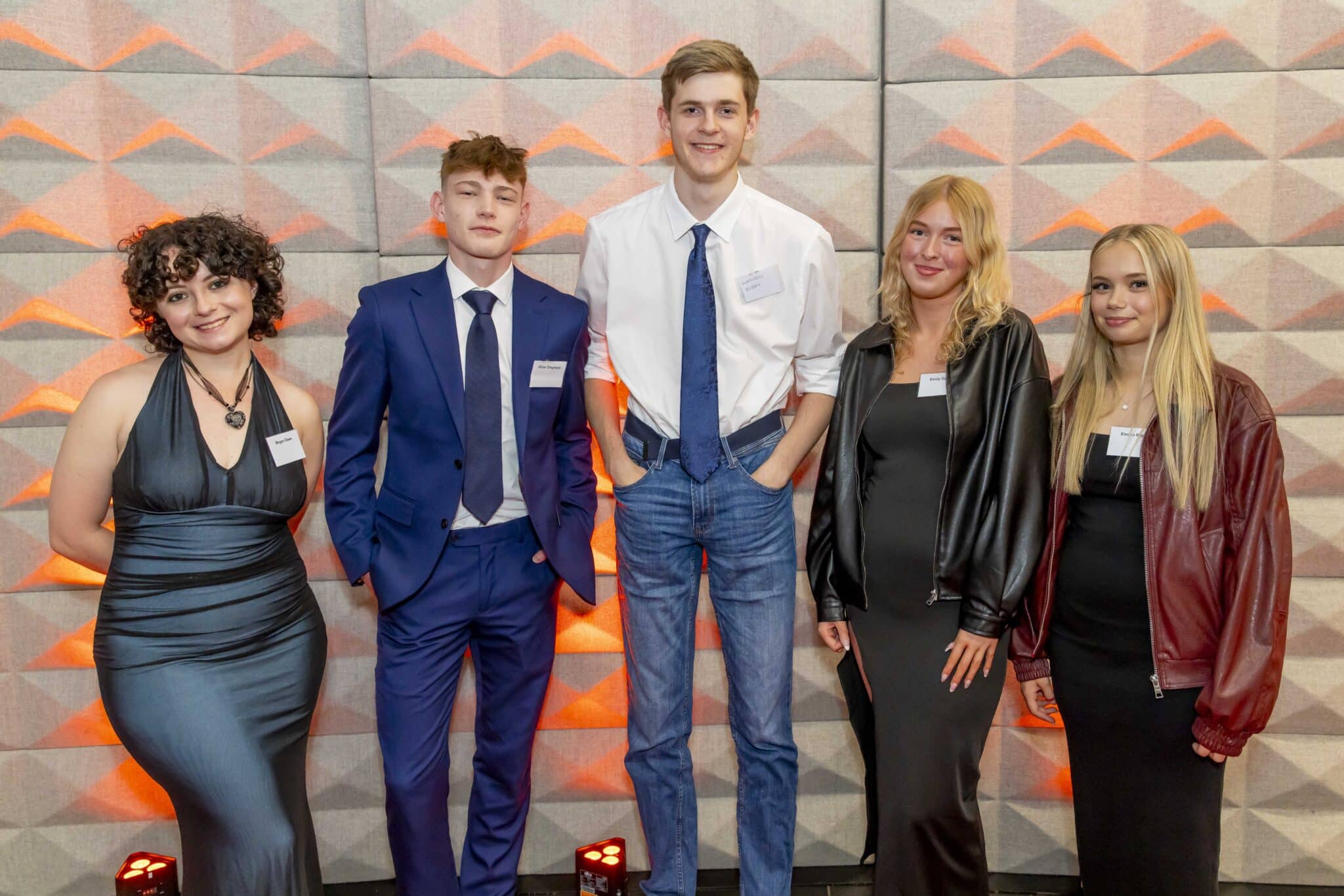 Students stood on a red carpet