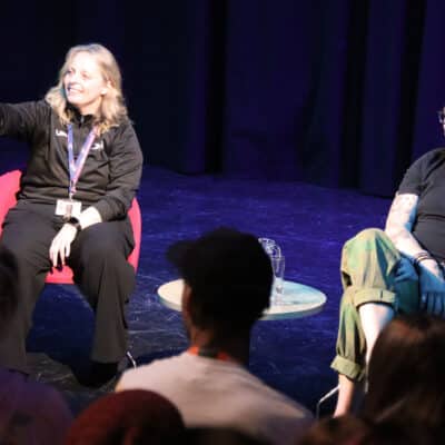 staff member pointing to student in audience during q&a