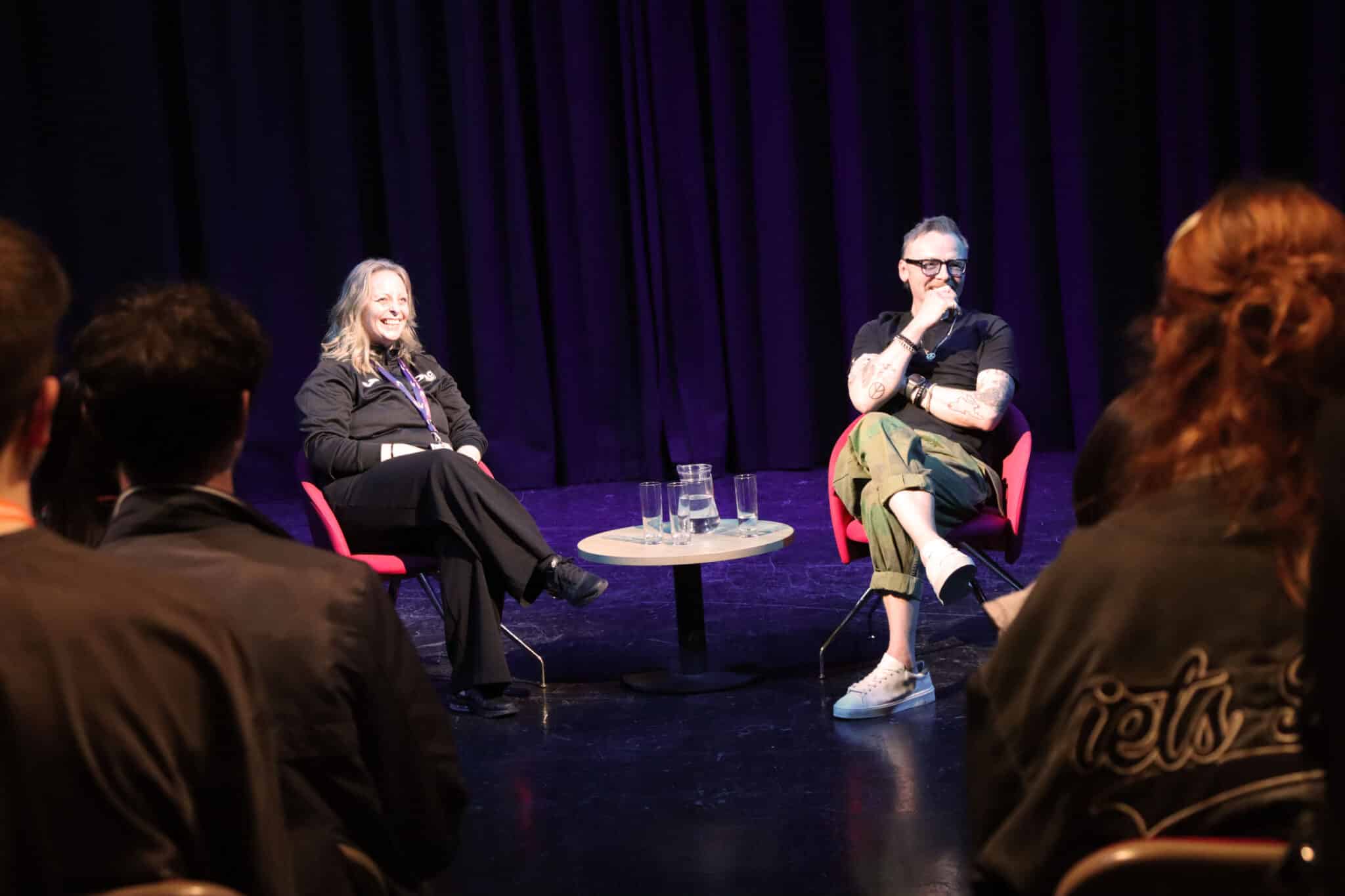 simon pegg and lecturer looking into audience smiling